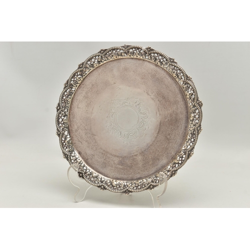 246 - A VICTORIAN SILVER SALVER WITH A WAVY, BEADED, PIERCED AND FOLIATE CAST BORDER, worn foliate engrave... 