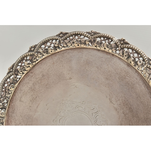 246 - A VICTORIAN SILVER SALVER WITH A WAVY, BEADED, PIERCED AND FOLIATE CAST BORDER, worn foliate engrave... 