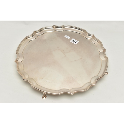 247 - AN ELIZABETH II SILVER SALVER, circular salver with a scroll border, hallmarked 'Francis Howard Ltd'... 