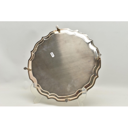 247 - AN ELIZABETH II SILVER SALVER, circular salver with a scroll border, hallmarked 'Francis Howard Ltd'... 