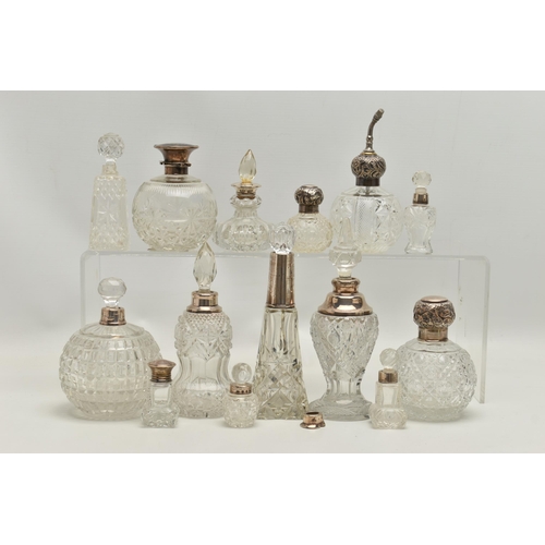 251 - FOURTEEN LATE 19TH AND EARLY 20TH CENTURY SILVER MOUNTED SCENT BOTTLES, various shapes and sizes inc... 