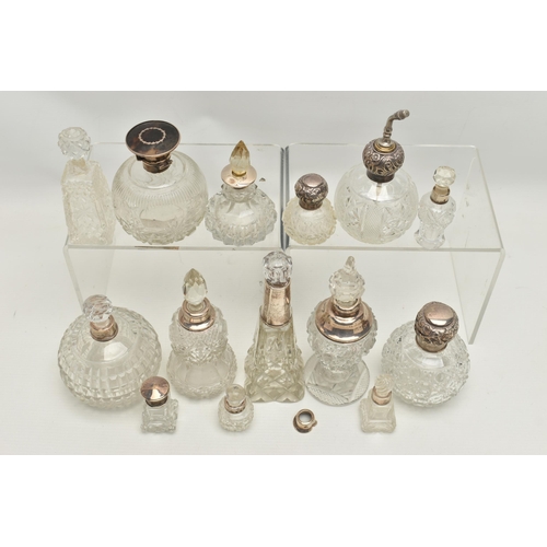 251 - FOURTEEN LATE 19TH AND EARLY 20TH CENTURY SILVER MOUNTED SCENT BOTTLES, various shapes and sizes inc... 