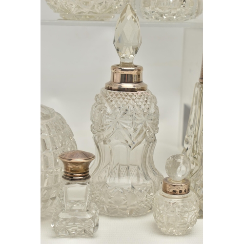 251 - FOURTEEN LATE 19TH AND EARLY 20TH CENTURY SILVER MOUNTED SCENT BOTTLES, various shapes and sizes inc... 