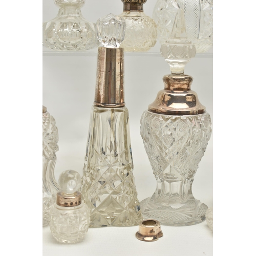 251 - FOURTEEN LATE 19TH AND EARLY 20TH CENTURY SILVER MOUNTED SCENT BOTTLES, various shapes and sizes inc... 