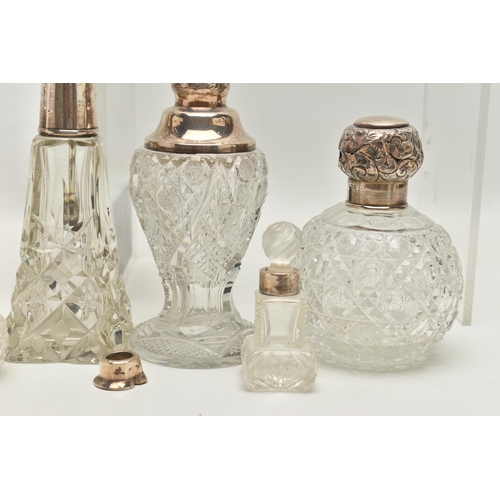 251 - FOURTEEN LATE 19TH AND EARLY 20TH CENTURY SILVER MOUNTED SCENT BOTTLES, various shapes and sizes inc... 