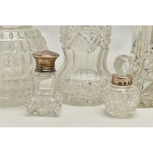 251 - FOURTEEN LATE 19TH AND EARLY 20TH CENTURY SILVER MOUNTED SCENT BOTTLES, various shapes and sizes inc... 