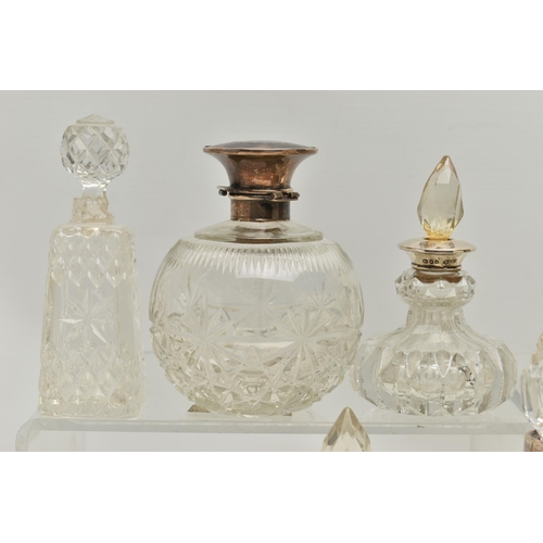 251 - FOURTEEN LATE 19TH AND EARLY 20TH CENTURY SILVER MOUNTED SCENT BOTTLES, various shapes and sizes inc... 