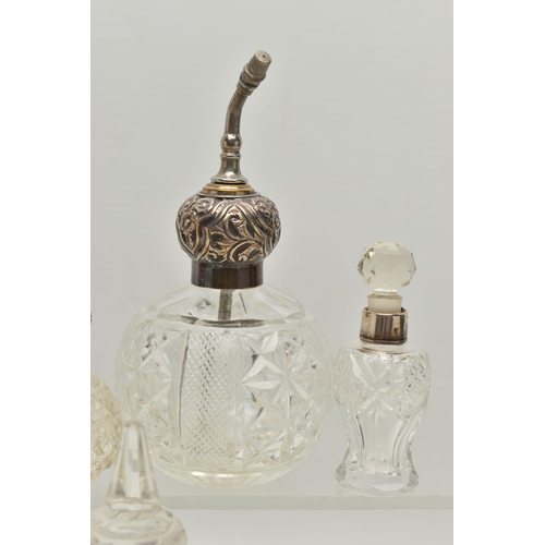 251 - FOURTEEN LATE 19TH AND EARLY 20TH CENTURY SILVER MOUNTED SCENT BOTTLES, various shapes and sizes inc... 