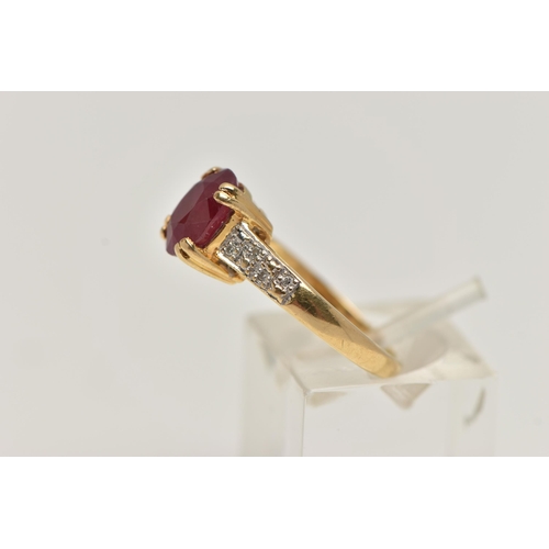 257 - AN 18CT GOLD RUBY AND DIAMOND RING, set with an oval cut ruby, four claw set, flanked with single cu... 