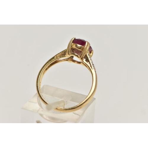 257 - AN 18CT GOLD RUBY AND DIAMOND RING, set with an oval cut ruby, four claw set, flanked with single cu... 