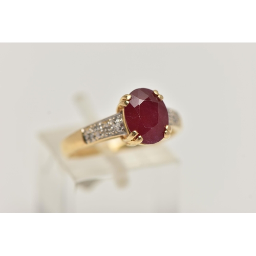 257 - AN 18CT GOLD RUBY AND DIAMOND RING, set with an oval cut ruby, four claw set, flanked with single cu... 