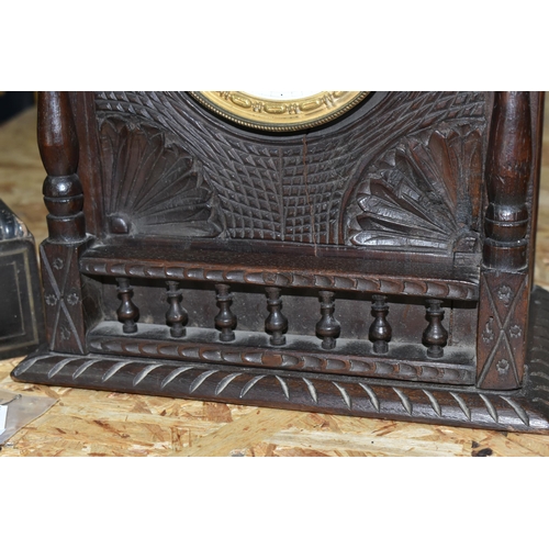 353 - TWO MANTEL CLOCKS, comprising a French portico clock in need of restoration and a carved wooden mant... 