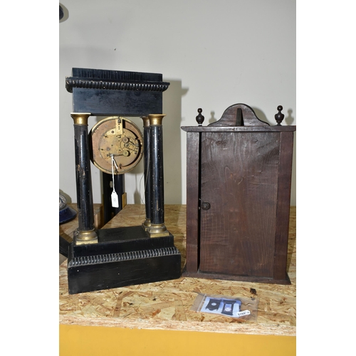 353 - TWO MANTEL CLOCKS, comprising a French portico clock in need of restoration and a carved wooden mant... 