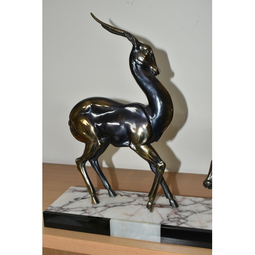 384 - AN ART DECO SCULPTURE OF A PAIR OF GAZELLES, in bronzed finish, on a three coloured marble plinth, h... 