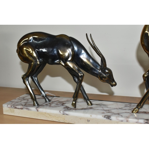 384 - AN ART DECO SCULPTURE OF A PAIR OF GAZELLES, in bronzed finish, on a three coloured marble plinth, h... 