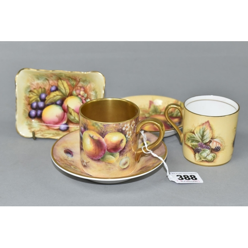 388 - A COFFEE CAN AND SAUCER HAND PAINTED BY ROYAL WORCESTER ARTIST BRYAN COX, painted with apples, grape... 