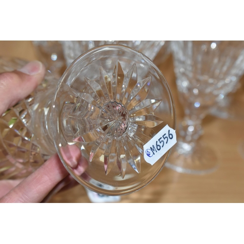 393 - SEVEN WATERFORD CRYSTAL GLASSES, in the Tranmore pattern, comprising two large wine glasses, and fiv... 