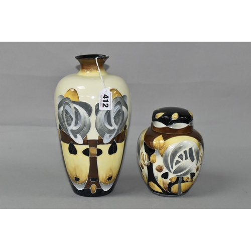 412 - TWO OLD TUPTON WARE VASES, decorated in the style of Charles Rennie Mackintosh, with stylised flower... 