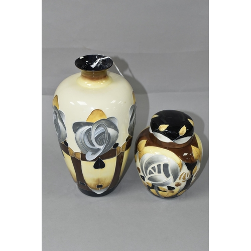 412 - TWO OLD TUPTON WARE VASES, decorated in the style of Charles Rennie Mackintosh, with stylised flower... 