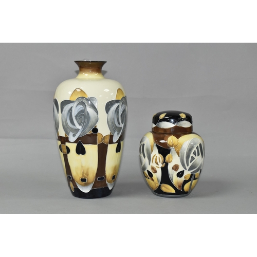 412 - TWO OLD TUPTON WARE VASES, decorated in the style of Charles Rennie Mackintosh, with stylised flower... 