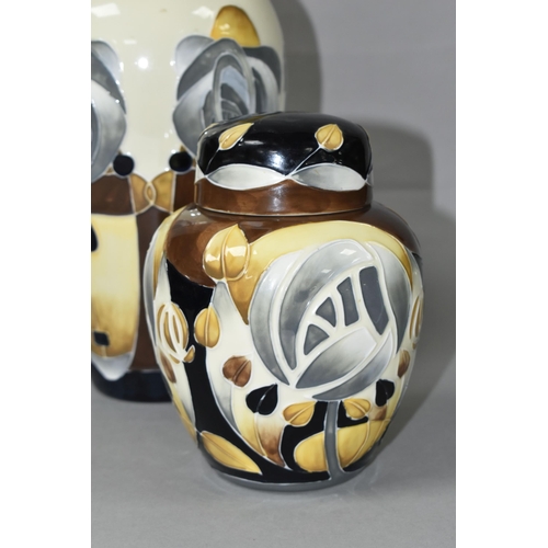 412 - TWO OLD TUPTON WARE VASES, decorated in the style of Charles Rennie Mackintosh, with stylised flower... 