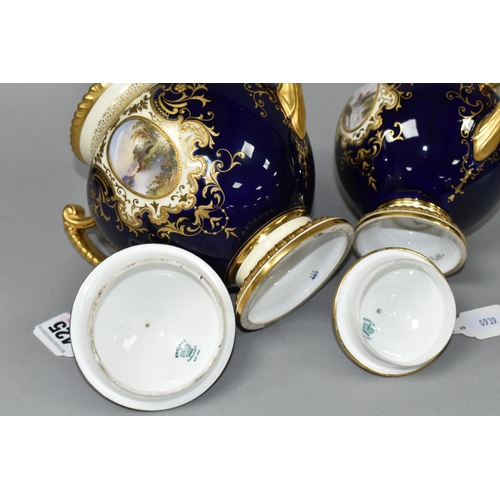 425 - TWO EARLY 20TH CENTURY COALPORT TWIN HANDLED VASES AND COVERS, blue, pale yellow and gilt ground, th... 