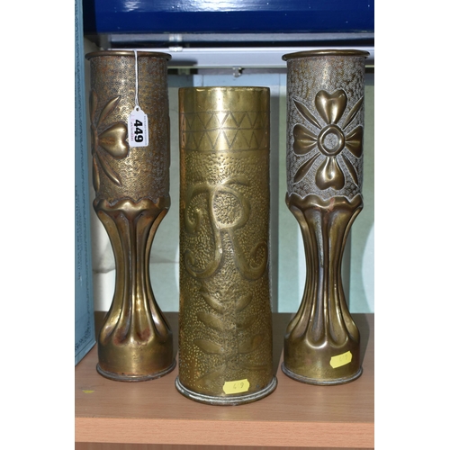 449 - A PAIR OF FLUTED TRENCH ART VASES, decorated with a floral design, together with a single trench art... 