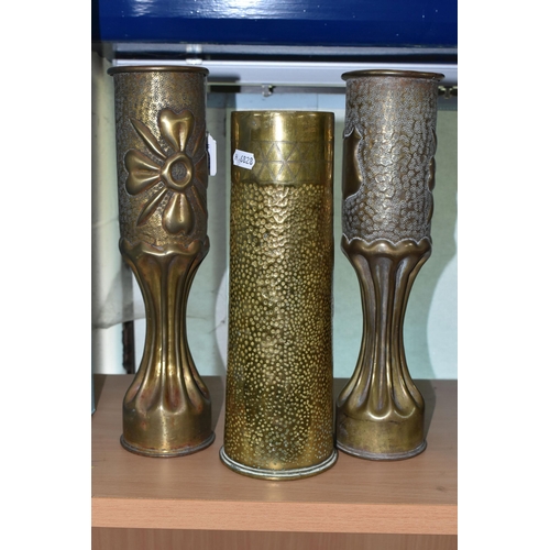 449 - A PAIR OF FLUTED TRENCH ART VASES, decorated with a floral design, together with a single trench art... 