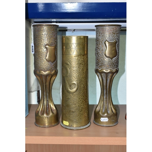 449 - A PAIR OF FLUTED TRENCH ART VASES, decorated with a floral design, together with a single trench art... 