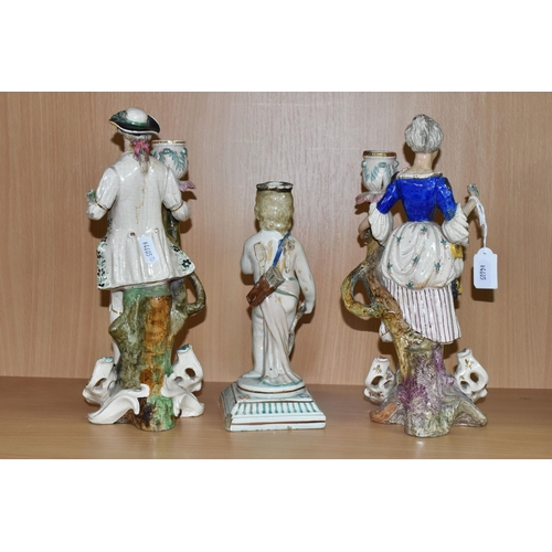 452 - A PAIR OF PORCELAIN FIGURAL CANDELABRA, blue painted marks to the base, together with a cherub candl... 