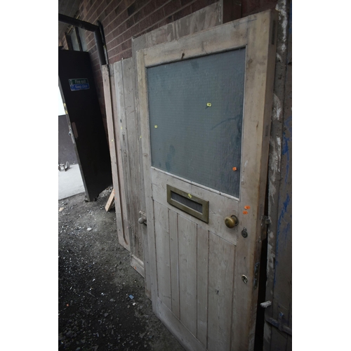 1001 - FIVE VARIOUS WOODEN EXTERNAL DOORS,of various shapes, sizes and ages, largest width 93cm x height 18... 