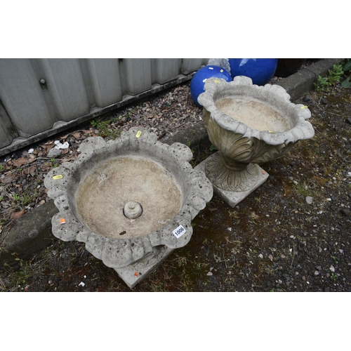 1006 - A PAIR OF WEATHERED COMPOSITE URNS, of foliate design, on a separate base, diameter 48cm x height 45... 