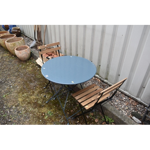 1017 - THREE FOLDING GARDEN ITEMS, to include a blue circular garden table, diameter 70cm x height 70cm, al... 