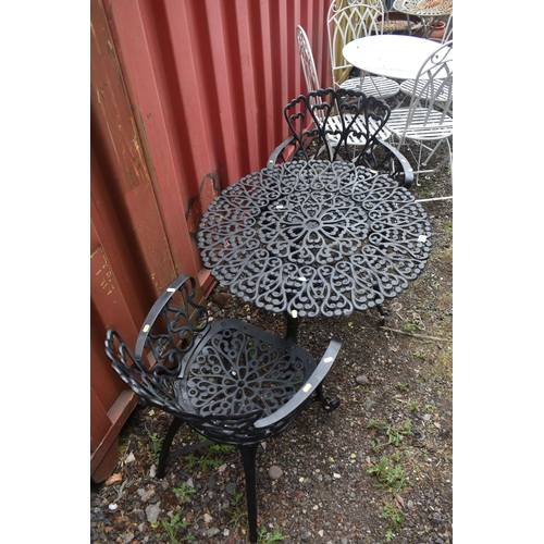 1018 - A WROUGHT IRON THREE PIECE GARDEN BISTRO SET, comprising a circular table, diameter 79cm x height 66... 