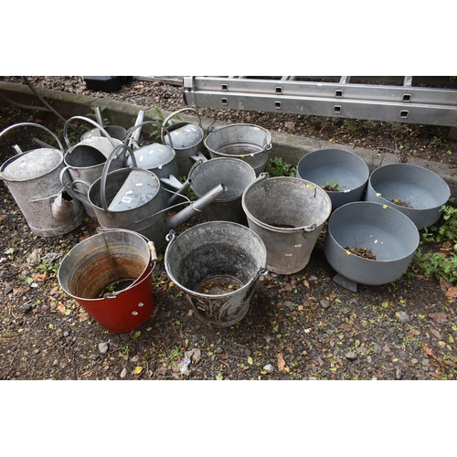 1021 - A SELECTION OF VARIOUS GALVANISED ITEMS, to include six sized watering cans, five buckets, including... 