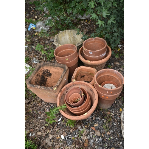 1027 - A VARIETY OF TERRACOTTA GARDEN PLANTERS, of different shapes and sizes, and a composite octagonal pl... 