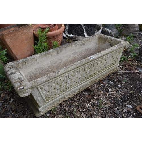 1028 - A RECTANGULAR COMPOSITE GARDEN PLANTER, with scrolled ends and detail, length 92cm x depth 34cm x he... 