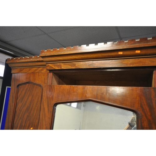 1201 - A VICTORIAN FLAME MAHOGANY TRIPLE DOOR COMPACTUM WARDROBE, the outer doors flanking a central mirror... 