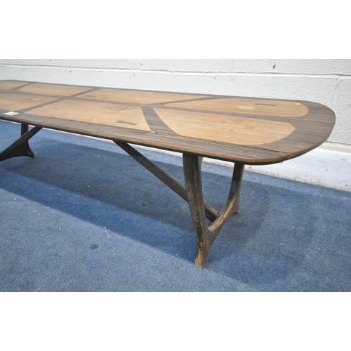 1203 - A MID CENTURY HEALS LONG TOM COFFEE TABLE, by Everest, on trestle legs united by a stretcher, label ... 