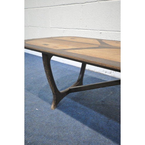 1203 - A MID CENTURY HEALS LONG TOM COFFEE TABLE, by Everest, on trestle legs united by a stretcher, label ... 