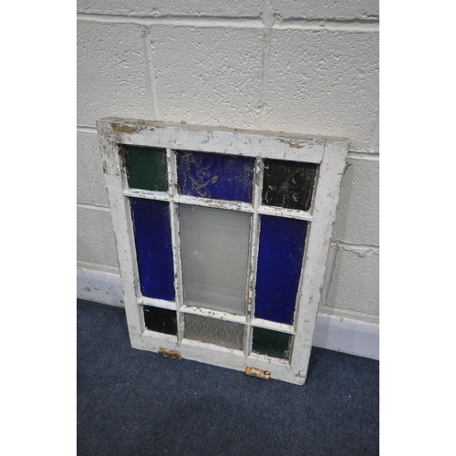 1204 - TWO VINTAGE COLOURED LEAD GLASS GEOMETRIC WINDOW, largest window, 88cm x 67cm, a set of three copper... 