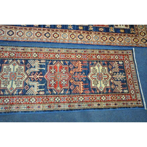 1224 - A TURKISH PATTERNED WOOL ON COTTON CARPET RUNNER, 300cm x 76cm, along with a similar smaller carpet ... 