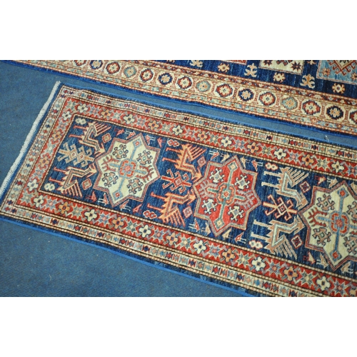 1224 - A TURKISH PATTERNED WOOL ON COTTON CARPET RUNNER, 300cm x 76cm, along with a similar smaller carpet ... 