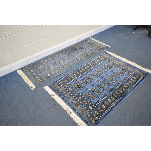 1225 - A WOOLLEN TEKKE RUG, with a blue field, 145cm x 99 cm, and a similar carpet runner 183cm x 63cm, alo... 