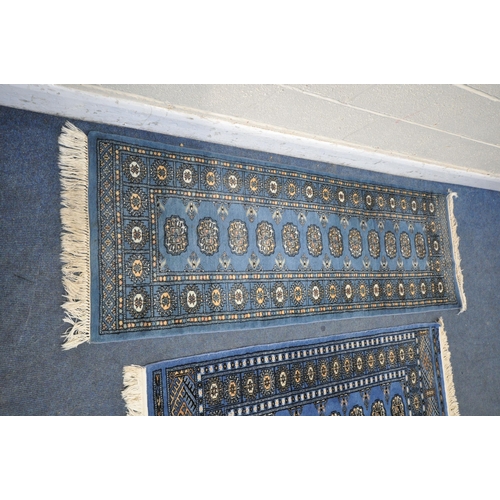 1225 - A WOOLLEN TEKKE RUG, with a blue field, 145cm x 99 cm, and a similar carpet runner 183cm x 63cm, alo... 