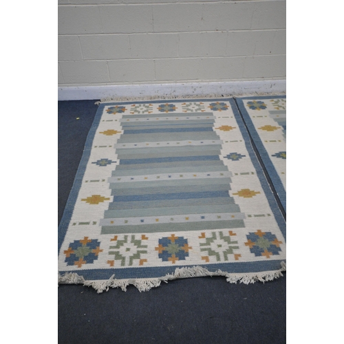 1226 - TWO GABBEH WOOLEN RUGS, blues and cream, larger rug 199cm x 143cm, smaller rug 196cm x137cm, along w... 