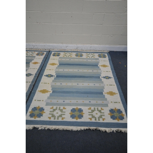 1226 - TWO GABBEH WOOLEN RUGS, blues and cream, larger rug 199cm x 143cm, smaller rug 196cm x137cm, along w... 