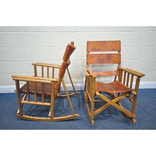 1229 - A PAIR OF MID CENTURY COSTA RICAN BEECH FRAMED AND LEATHER STRAPPED FOLDING ROCKING CHAIRS (conditio... 