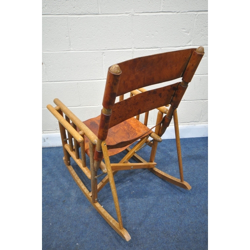 1229 - A PAIR OF MID CENTURY COSTA RICAN BEECH FRAMED AND LEATHER STRAPPED FOLDING ROCKING CHAIRS (conditio... 