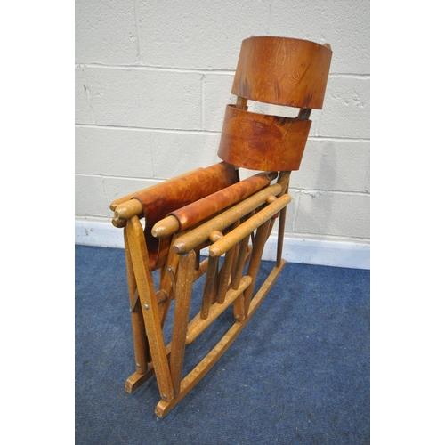 1229 - A PAIR OF MID CENTURY COSTA RICAN BEECH FRAMED AND LEATHER STRAPPED FOLDING ROCKING CHAIRS (conditio... 